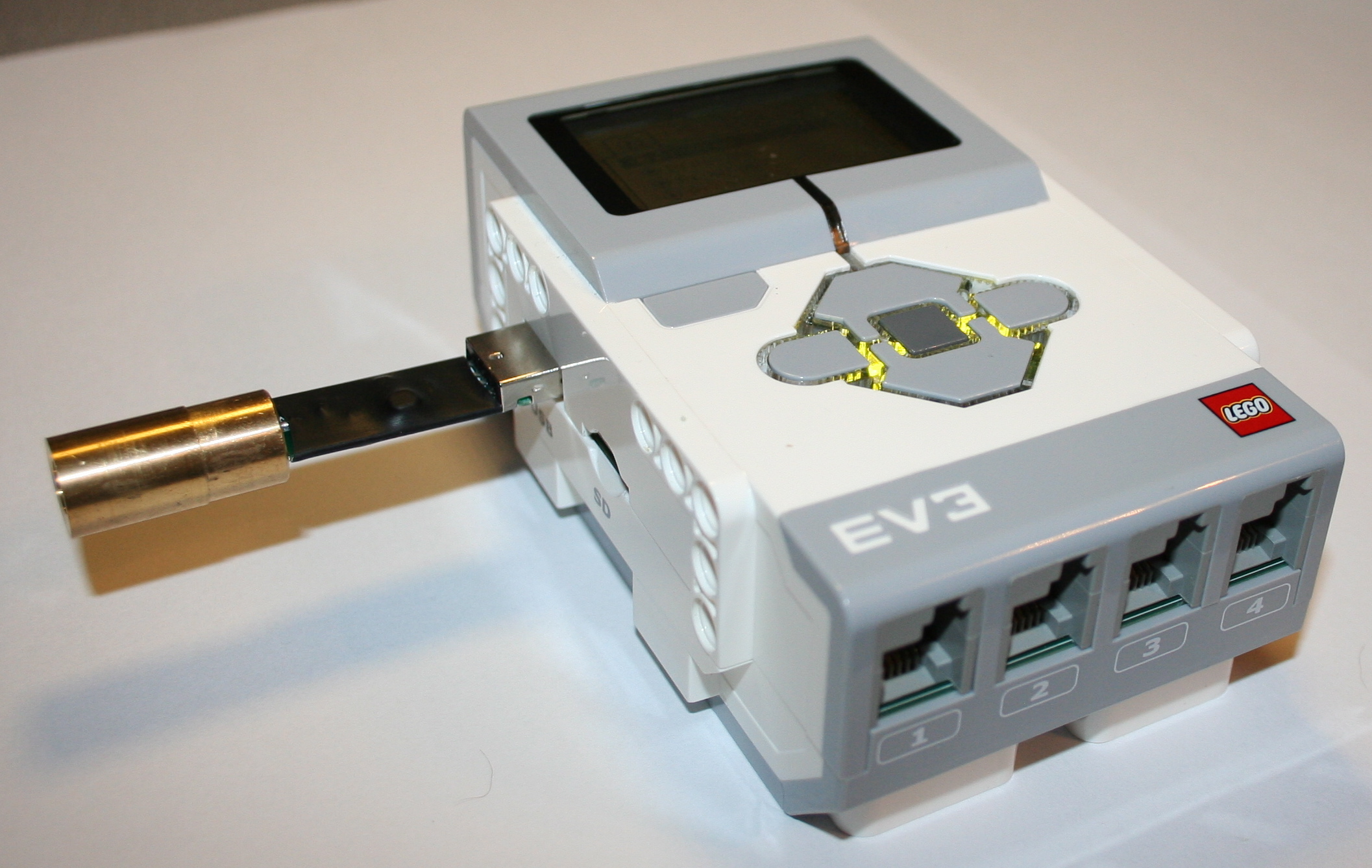 A diode laser module with a USB power connection.